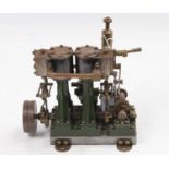 A Stuart Turner D10 stationary marine engine, comprising of twin cylinders suspending on A frames,