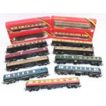 Approx thirty-two 00 gauge bogie coaches (of which 9 are boxed) various makes and liveries.