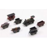 Early 20th-century miniature metal and diecast train set, comprising 0-6-0 Steam locomotive and
