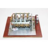 A very well made model of a V8 Stationary Engine, housed on a wooden plinth, free-running example,