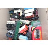 Approx forty-eight 00 gauge four-wheel goods wagons plus two breakdown cranes. Variety of makes