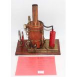 Cheddar Models Gas Powered Fire Tube boiler, housed on wooden and brass display plinth, with water