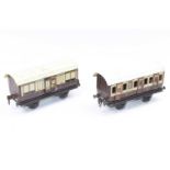 Two Gauge 1, 4-wheel LNWR coaches, Marklin, one marked ‘Gamages’ one all 1st 2871, one door handle