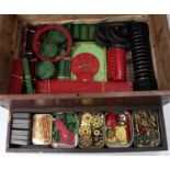 A large wooden crate containing red & green Meccano with brassware, wheels, plates etc. Overall