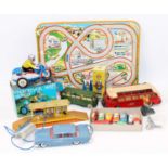 Two trays containing a mixed selection of tinplate and other toys to include, Lehmann tinplate Seal,