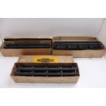 Three original Bassett-Lowke boxes of clockwork/2-rail steel track with attached fishplates, appears