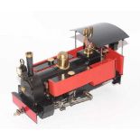 32mm scale gas-powered model of an 0-6-0 live steam locomotive, finished in burnt orange, executed