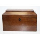 A mid 19th century mahogany three compartment tea caddy of rectangular form with kite shaped ebony