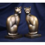 A pair of composition models of cats, height 28cm