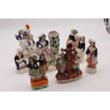 A collection of seven Victorian Staffordshire flat back figures, height 22cm