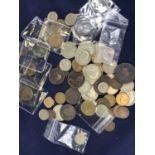 A small collection of British and world coins, to include 1920 florin, 1942 half crown, 1966