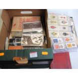 A collection of military ephemera to include WW II prisoner of war postcards, assorted cigarette