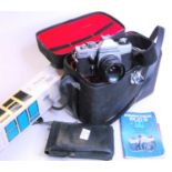 A collection of vintage photography equipment to include a Praktica PLC3 camera