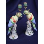A pair of 20th century continental porcelain and gilt metal table candelabra, each in the form of