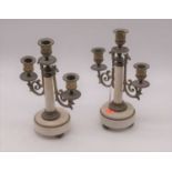 A pair of 20th century brass and polished hardstone three branch table candelabra, height 26cm