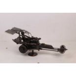 A 20th century sculpture of a Dragster racing car, constructed from nuts, bolts and scrap metal,