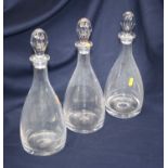 A set of three 20th century glass decanters, of mallet form, each height 36cm