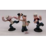 A set of three painted cast iron figures of Popeye the Sailorman, height of largest 16cm