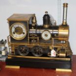 A mantel clock, barometer and thermometer in the form of a steam locomotive mounted upon a