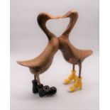 A pair of modern carved bamboo models of ducks in groups kissing, h.50cm