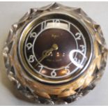 A mid-20th century Russian Majak wall clock, having a raised silvered dial with Arabic numerals