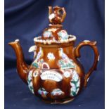 An early 20th century bargeware teapot inscribed Auld Lang Syne 1911, height 29cm