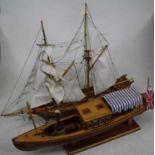 A 20th century hand built wooden model of a 17th century style ship on stand, height 42cm;