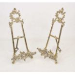 A pair of 20th century Rococo style brass table easels, with C-scroll and rocaille decoration,