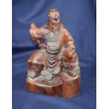 A 20th century Chinese carved wood figure of a man, h.31cm