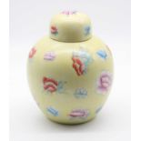 A 20th century Chinese porcelain ginger jar and cover, floral decorated upon a yellow ground, h.