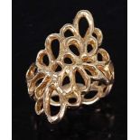 A 1970s 18 carat gold dress ring, of all over pierced abstract form, maker AB, London 1972, 7.5g,