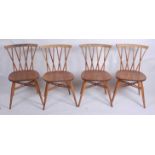 A set of four 1960s Ercol light elm candlestick kitchen chairs, model No.3462, w.41.5cm