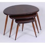 A 1960s Ercol dark elm nest of three 'pebble' occasional tables, each on turned tapering supports,