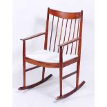 Arne Vodder (1926-2009) for Sibast - a 1960s rosewood rocking armchair, having bar and stick back,