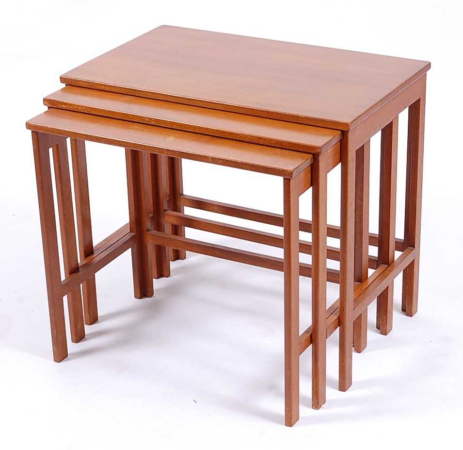 France & Son - a Danish 1960s teak nest of three occasional tables, raised on plain rectangular