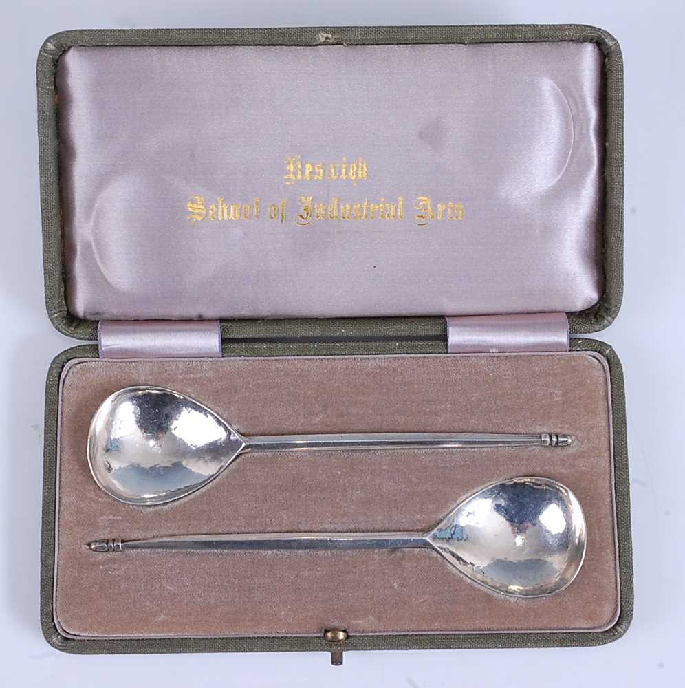 A pair of Keswick School of Industrial Arts silver spoons, each with teardrop shaped hammered
