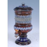 A late 19th century Doulton Lambeth stoneware table water filter, with bands of relief decoration,