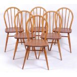 A set of six Ercol 1960s light elm stickback kitchen chairs, labels verso, w.40cm