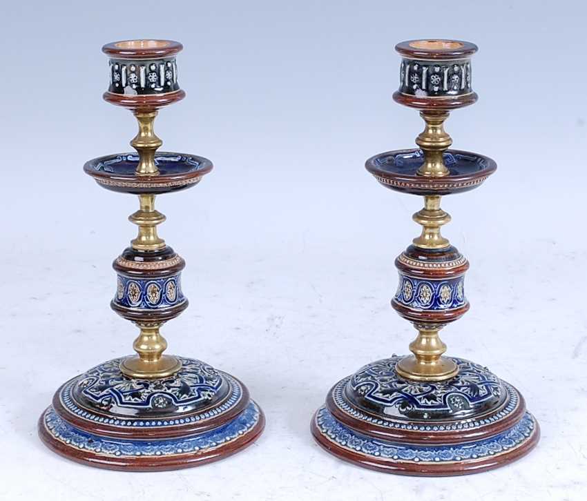 A pair of circa 1900 Doulton Lambeth stoneware candlesticks, with incised guilloche and foliate