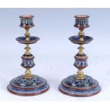 A pair of circa 1900 Doulton Lambeth stoneware candlesticks, with incised guilloche and foliate