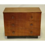 A mid-20th century Czechoslovakian oak chest of three long drawers, having turned button handles and