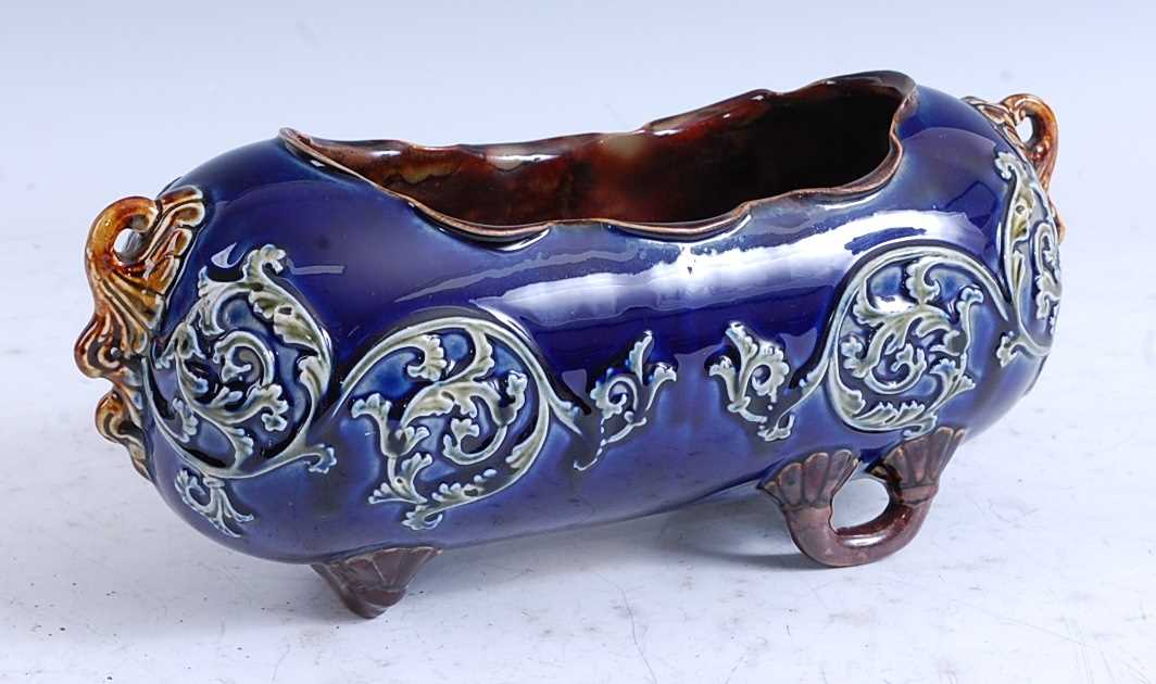 A late 19th century Doulton Lambeth stoneware trough or 'pig', with applied trailing vine dcoration,