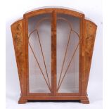 An Art Deco figured walnut and crossbanded double door glazed china display cabinet, of tapering