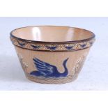 An 1878 Doulton Lambeth stoneware flower pot, decorated with swans, incised monogram for Hannah