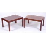 A pair of 1960s Danish rosewood low occasional tables, the slightly raised integral panelled top