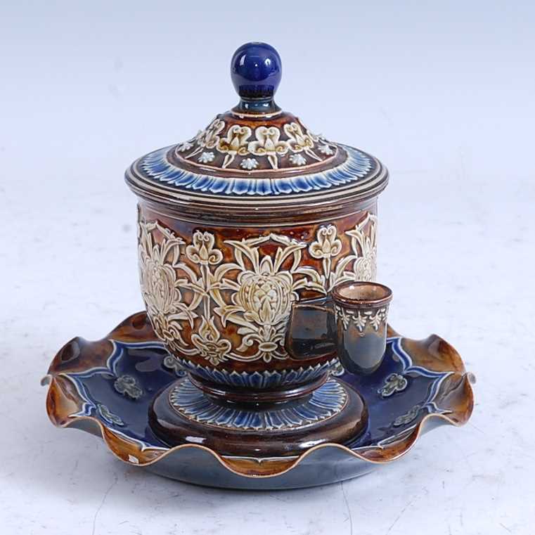 A late 19th century Doulton Lambeth stoneware isobath inkwell, relief decorated with stylised