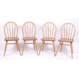 A set of four 1960s Ercol elm stickback kitchen chairs, w.40cmCondition report: Each stand well