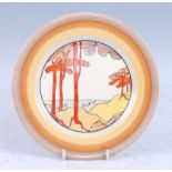 A 1930s Clarice Cliff Coral Firs pattern plate, decorated with stylised trees within graduated