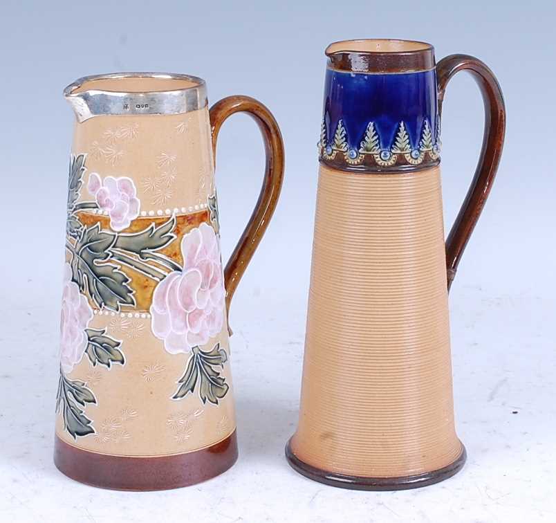 An 1817 Doulton Lambeth stoneware jug, the silver rim above a tapered body tube-line decorated