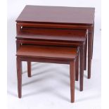 A 1960s Danish rosewood nest of three occasional tables, having thumb-moulded upper edge detail,